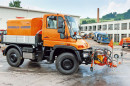 MK – 4 s čelným agregátom a roztrekovacou lištou na podvozku UNIMOG U400